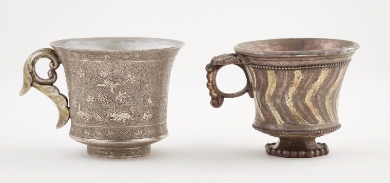 Two footed cup with ring handle