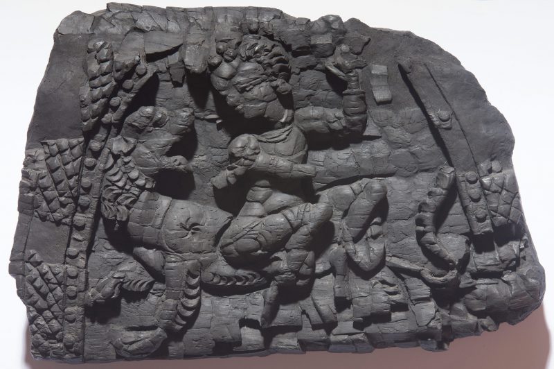 Half-circle panel with a goddess sitting on a lion