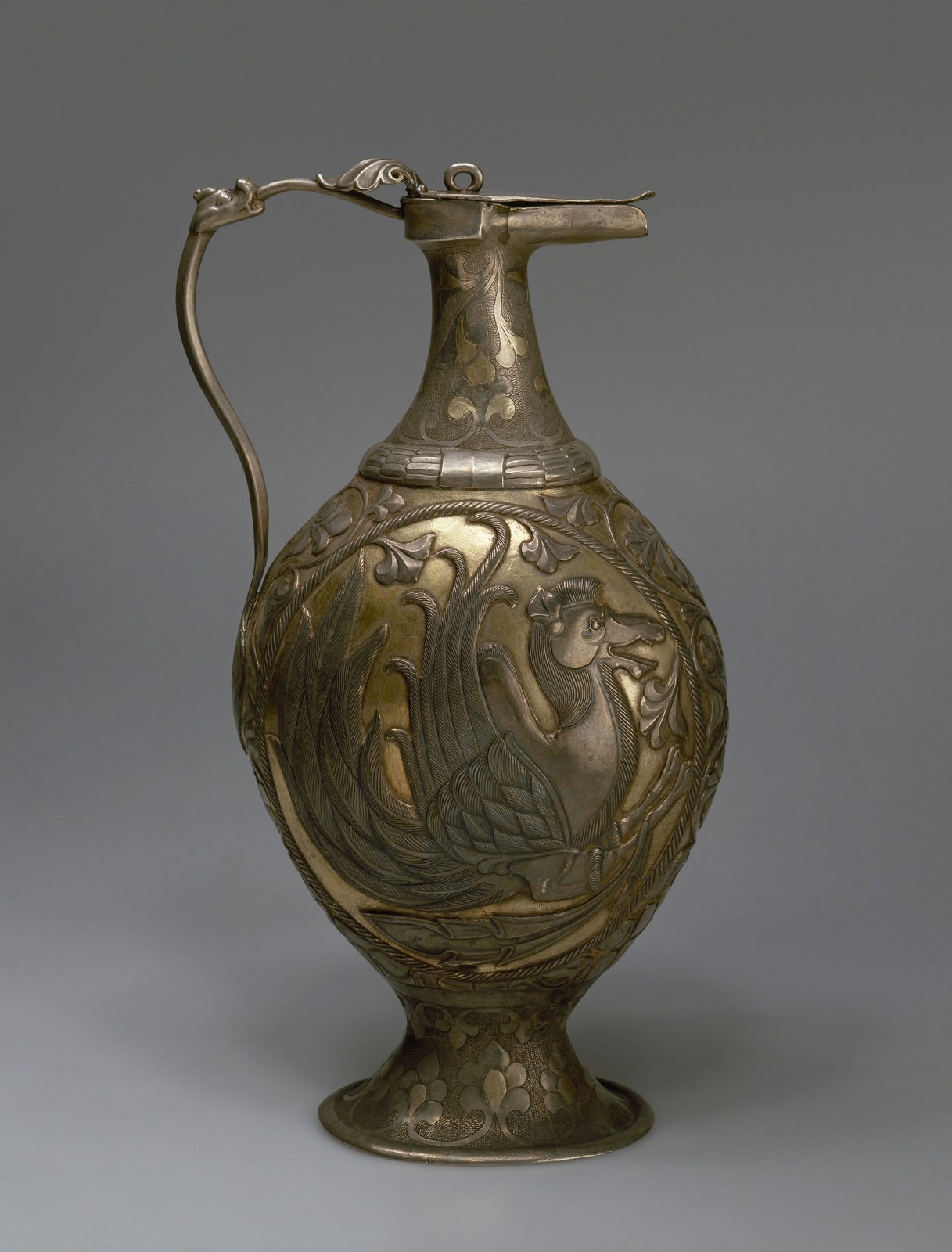 Ewer with thin handle, bulbous body and wide foot