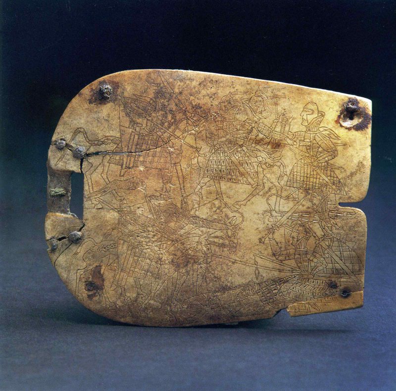 Square bone plaque with lightly incised battle scene