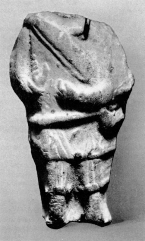 Headless figure holding an angular harp