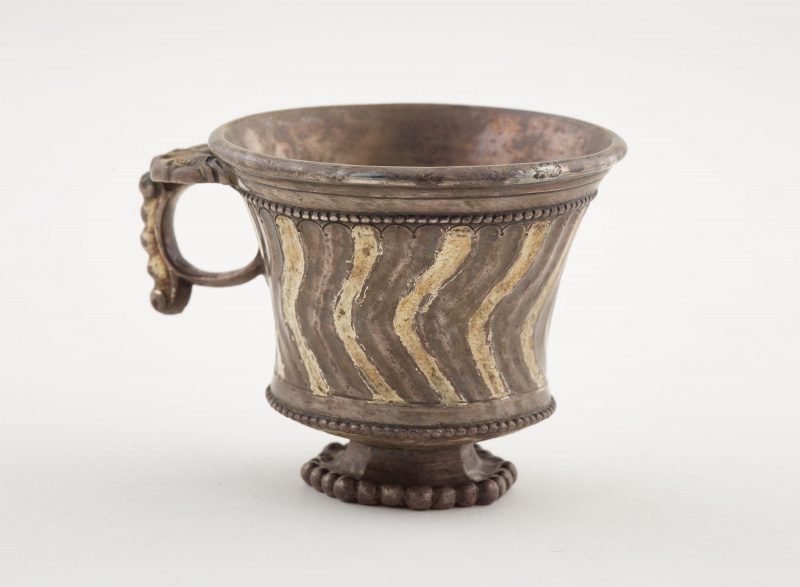 Footed cup with ring handle