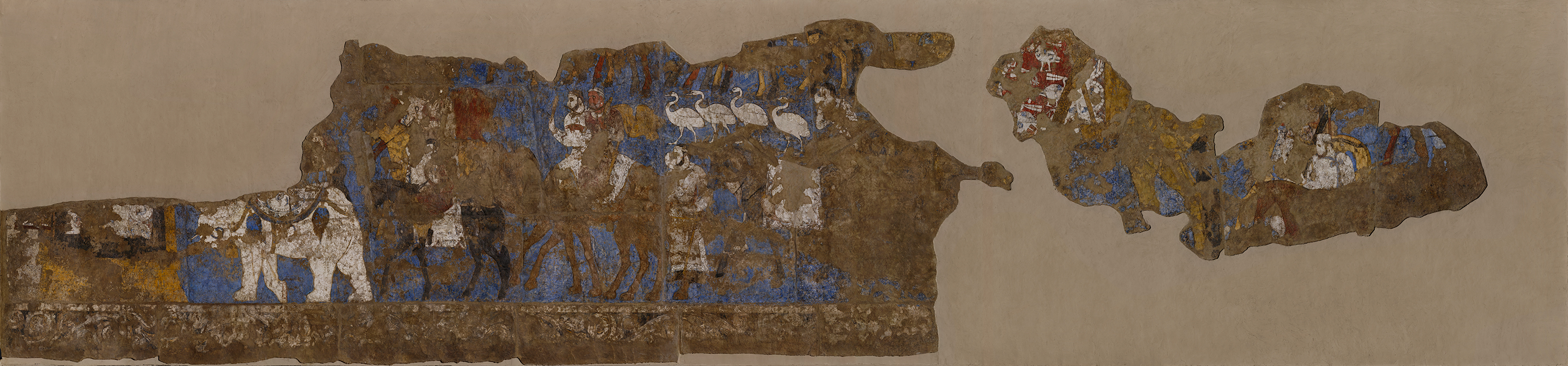 On the Southern Wall of the Hall of Ambassadors at Afrasiab, the wall paintings depict a procession of people seemingly from different parts of the world as indicated by their dress and animals bearing gifts.